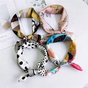 Set of four stylish silk-like square scarves with assorted patterns and bow-knot styling