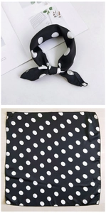 Close-up of classic black and white polka dot silk-like square neck scarf for women