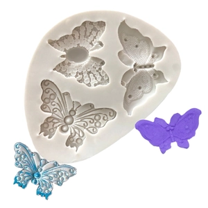 Detailed silicone mold showing three butterfly patterns with purple and blue resin samples