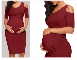 Detail of off-shoulder short sleeve maternity dress in wine red with ruched side seams