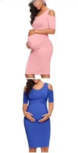 Detail of ruched side seams on maternity off-shoulder dress in pink and blue
