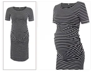 Detail of maternity dress featuring classic black and white stripes and side ruched design