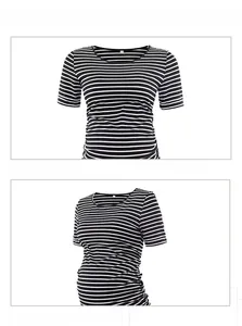 Close-up of crew neck and side ruching detail on a black and white striped maternity dress