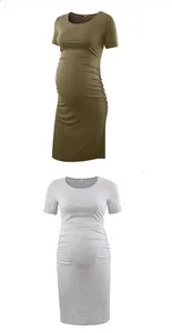 Detail view of side-ruched maternity dress in army green and light grey knit fabric