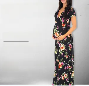 Close-up of the elegant floral print and deep V-neckline on this maternity maxi dress