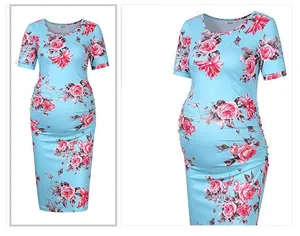 Detailed pattern view of light blue floral maternity dress with pink roses and crew neck