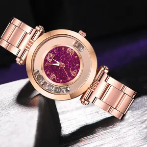 Detail view of rose gold watch with purple glitter dial and moving crystal accents