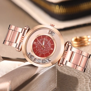 Montre femme or rose avec cadran rouge ciel étoilé et cristaux mobiles décoratifs