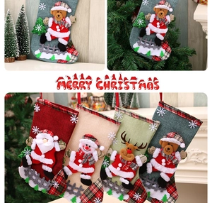 Set of four large Christmas stockings featuring 3D Santa, snowman, and reindeer patterns
