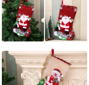 Detailed view of 3D applique embroidery on linen Christmas stockings with Santa and Snowman