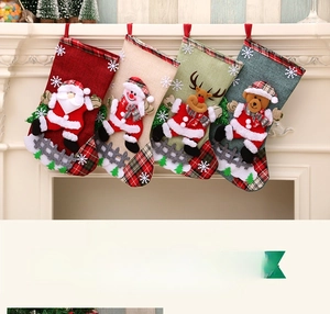 Detailed view of four hanging Christmas stockings with 3D Santa, Snowman and Reindeer