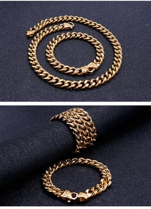 Detailed view of golden stainless steel Cuban link chain necklace and bracelet set