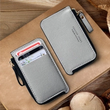 Detail of grey PU leather mini coin purse featuring card slots and zipper closure
