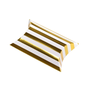 Close-up of a mini pillow gift box with gold and white stripes on glossy cardboard