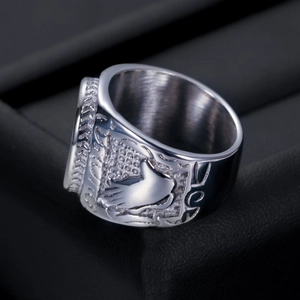 Detail shot of vintage 21mm silver stainless steel cross ring on black velvet display