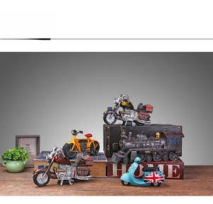 Set of retro miniature transportation models like vintage motorcycles and steam trains