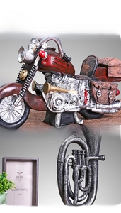 Detailed view of handcrafted retro motorcycle model with vintage finish for shelf decor
