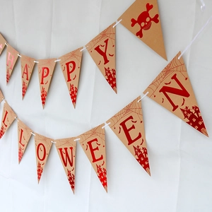 Detail of Happy Halloween kraft paper bunting flags with spooky bats and spider webs
