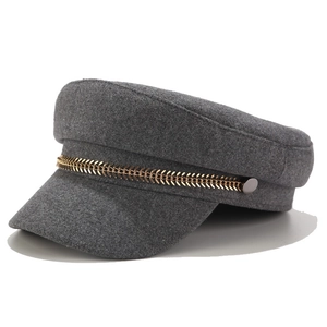 Classic dark grey wool newsboy cap with gold leaf chain detail on a white background