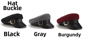 Detailed view of three wool newsboy caps in black, grey, and wine red with leather brims