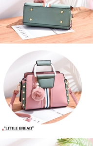 Detail of color-block PU leather bag with gold rivets and pink plush charm