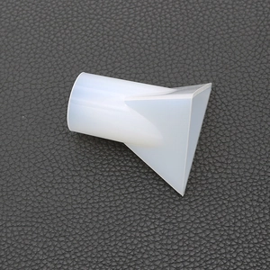 Close-up of translucent silicone pyramid mold with flat fan-shaped nozzle structure