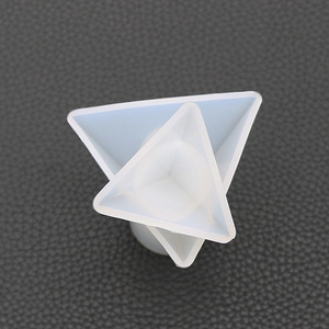 Macro view of translucent silicone mold featuring geometric nested triangle shapes for resin DIY