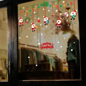 Festive Christmas window stickers featuring Santa Claus, music notes, and Merry Christmas text