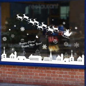 White Christmas window decals featuring Santa, reindeer, and European city silhouettes