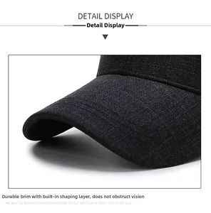 Detail of grey cotton baseball cap showing sturdy brim and high-quality fabric texture