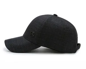 Detail view of dark gray baseball cap with woven texture and round R ZG side emblem