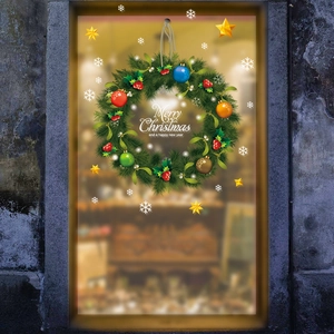 Christmas wreath window decal with red berries and ornaments for festive glass decoration
