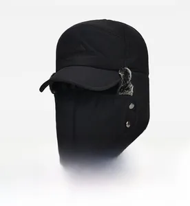 Detail of black winter trapper hat with windproof face mask and side metal buttons