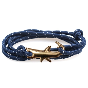 Men's navy blue braided rope bracelet featuring a polished gold shark anchor clasp