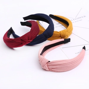 Knitted knotted headbands set in burgundy, navy, yellow, and pink colors for women