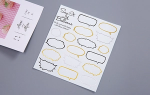 Detail of gold and silver foil speech bubble stickers for DIY planners and journals
