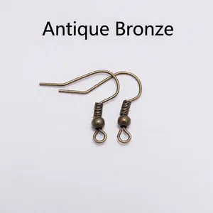 Close-up of antique bronze stainless steel earring hooks with beads for DIY jewelry