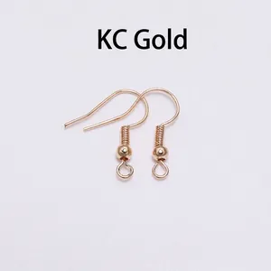 Detailed view of KC gold fishhook earring wires with coil and bead for DIY jewelry