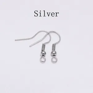 Close-up of silver-plated stainless steel fish hook earrings with coil and loop