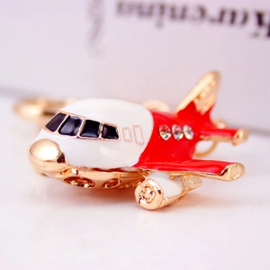 Red and gold airplane keychain with sparkling crystals and durable alloy finish