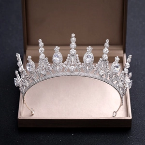 Exquisite silver bridal hair comb with shimmering crystals in a beige jewelry gift box