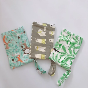 Three-piece eco-friendly cotton wrist pouches with cute fox, polar bear and leaf prints