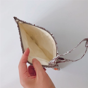 Detail showing the inner lining and red wave pattern of this cotton zipper pouch