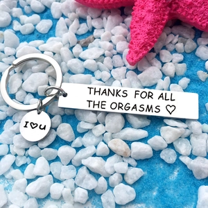 Detail of stainless steel keychain with I Love You charm and funny engraved message