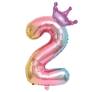 Macro shot of gradient number 2 foil balloon with pink princess crown for birthday parties