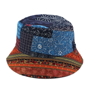 Bohemian style patchwork bucket hat with floral and geometric patterns for sun protection