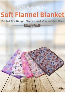 Soft flannel pet blankets with colorful paw prints in five colors stacked on wood floor