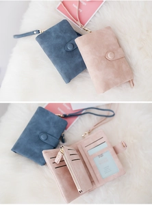 Detail view of tri-fold frosted suede wallet showing card slots and zipper coin pocket