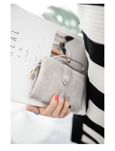 Elegant light gray matte trifold wallet for women with wristlet and golden hardware