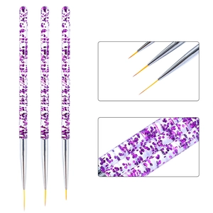 Macro detail of fine orange bristles and purple glitter handles on nail art brush set